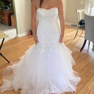Oleg Cassini wedding dress. Never worn. Size 10. Pretty firm on the price